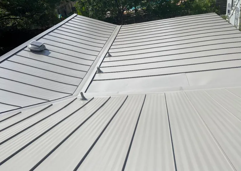 Solar attic fan installed on a metal roof for Roof Ventilation in San Juan
